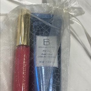 Brand new mini lip gloss/hand cream with gift bag!